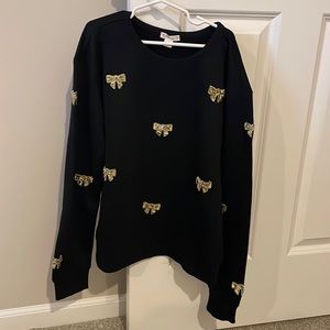 Black sweater with gold bows on it!!
